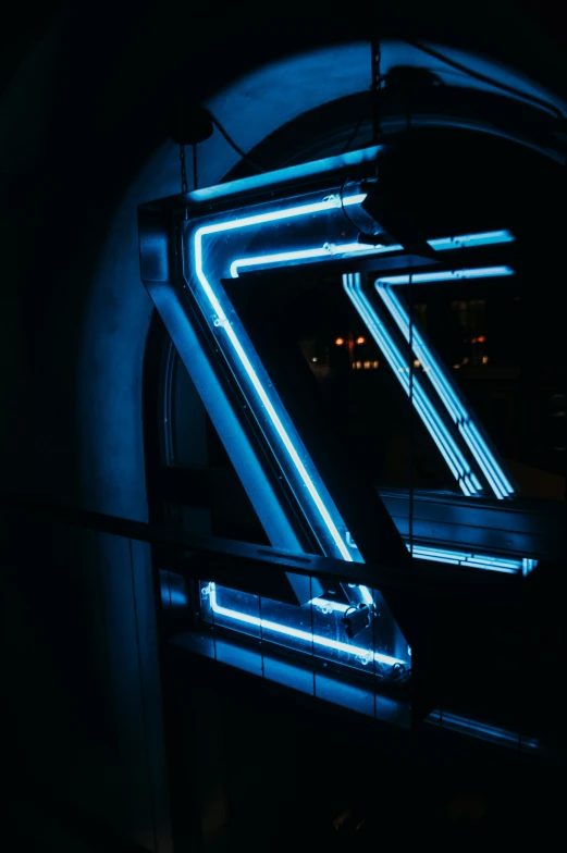 a lit up z sign is sitting by some dark