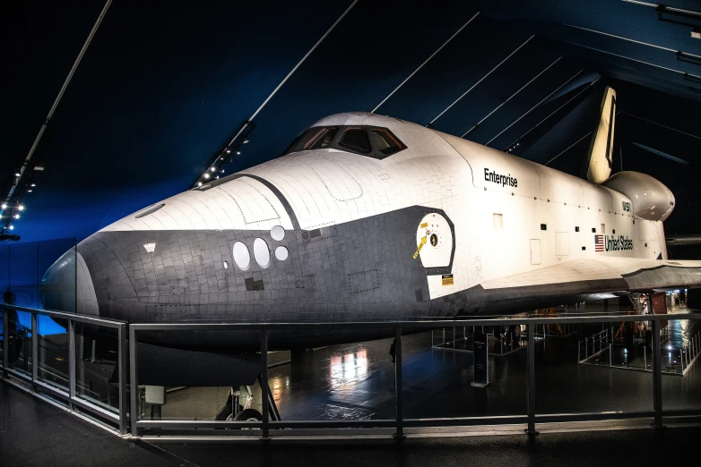 an exhibit of a space shuttle on display in a building