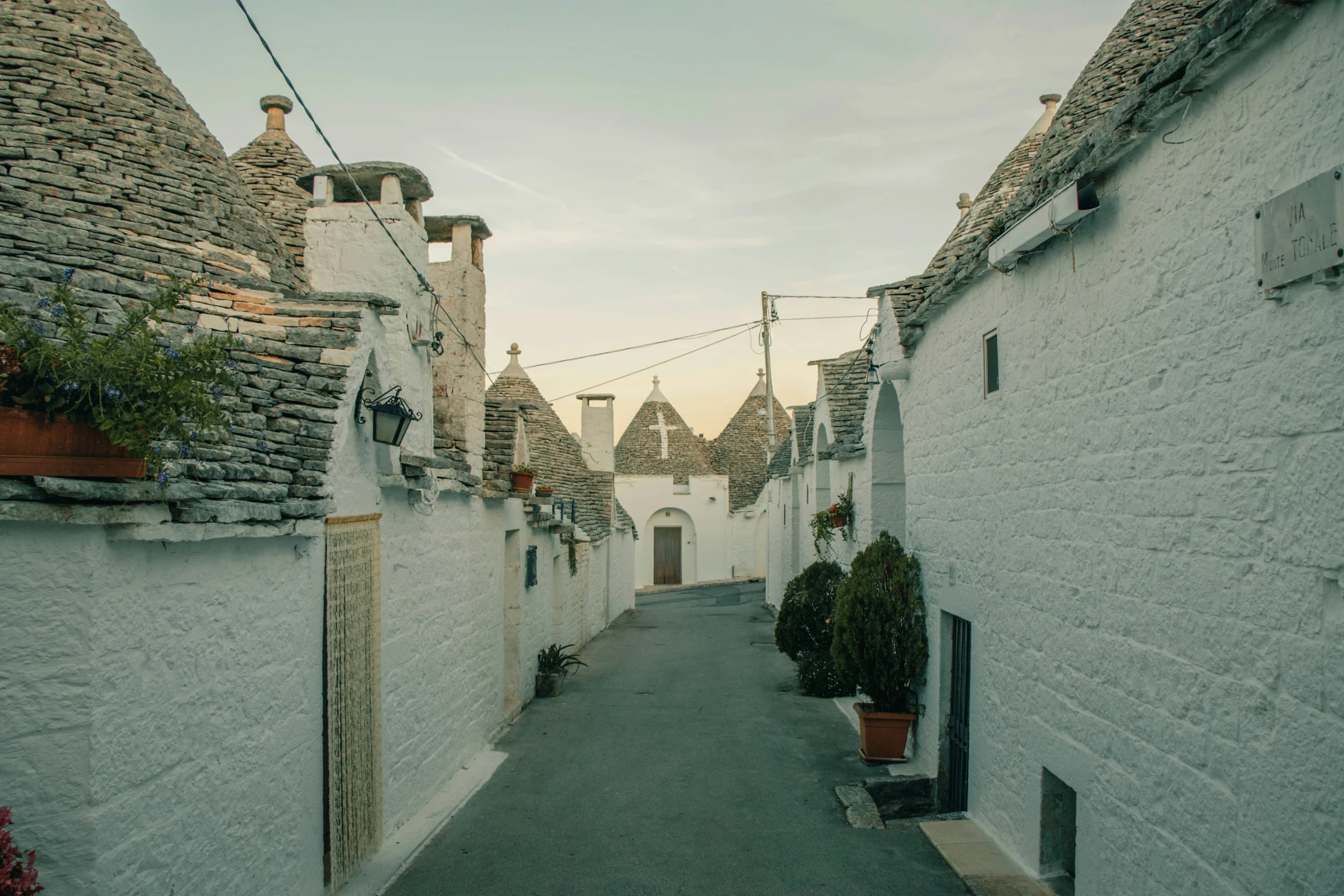 old houses lining an alley in a town with cobblestones