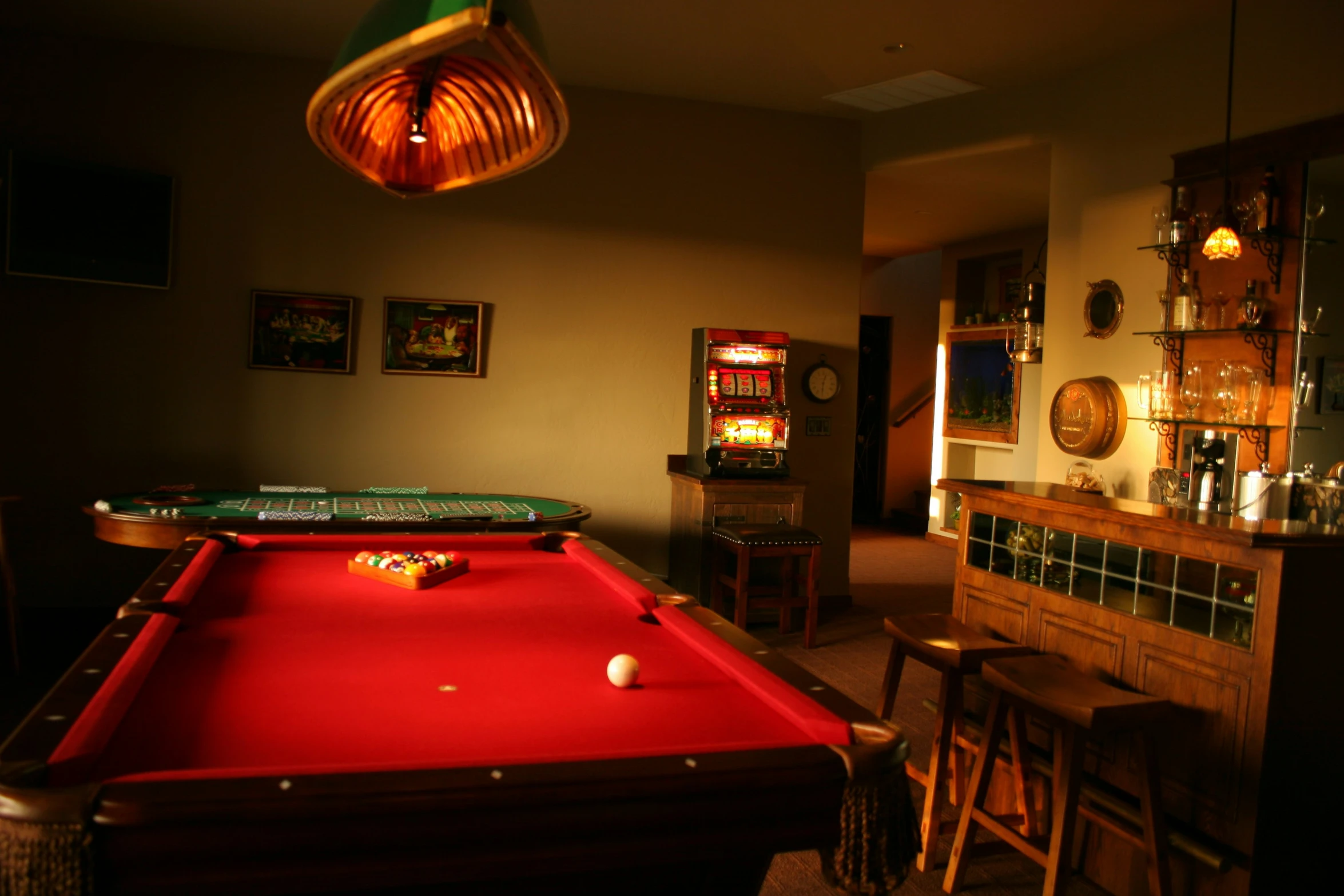 a pool table with an illuminated red cloth