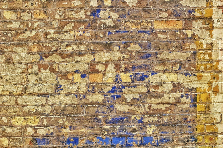 the corner of a building made of different colored bricks