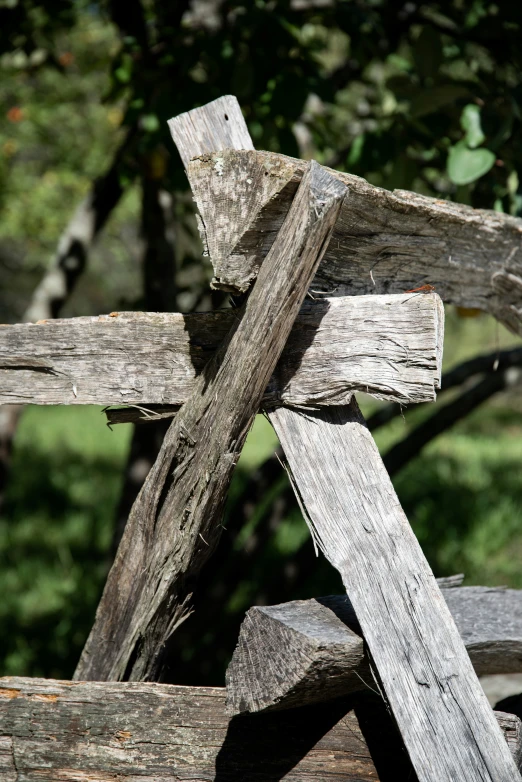 an old wooden fence with a bird on top of it