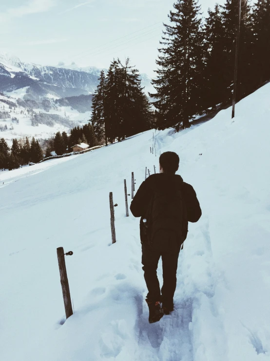 a man in skis coming down a hill