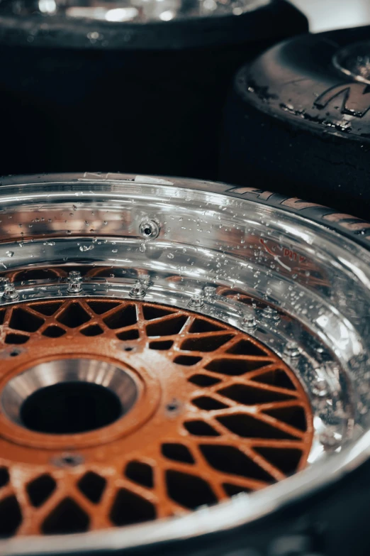 a tire wheel with brown spokes on an antique car