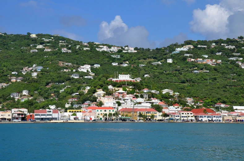 a town on top of the hill next to the water