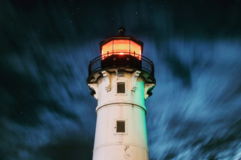 a light house with the sky in the background