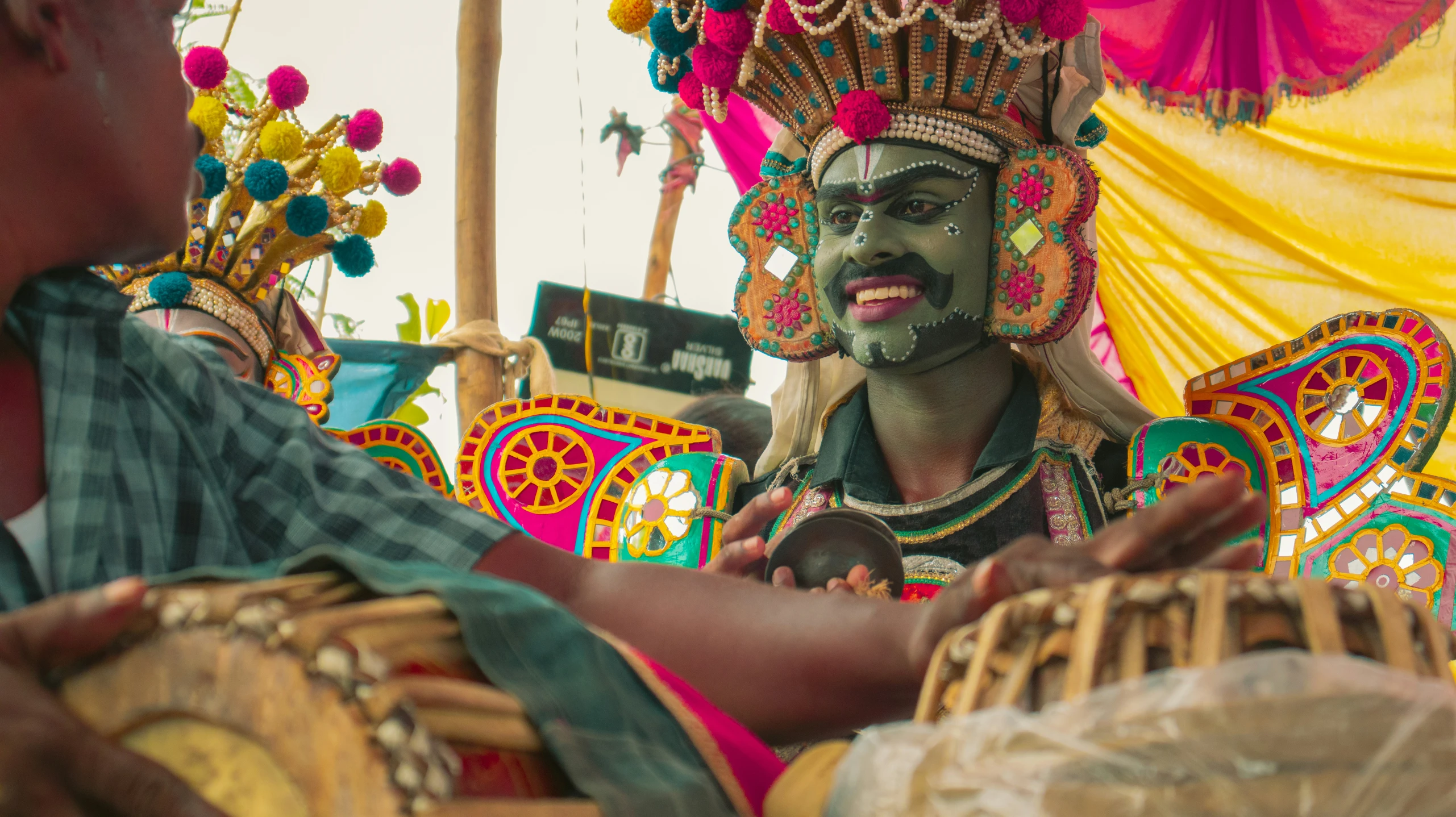 people dressed up and performing some cultural music