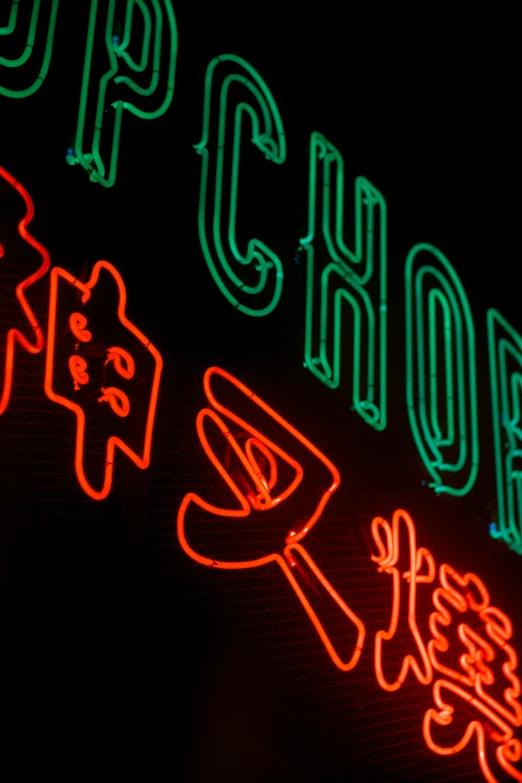 a large lit up neon sign in an asian language