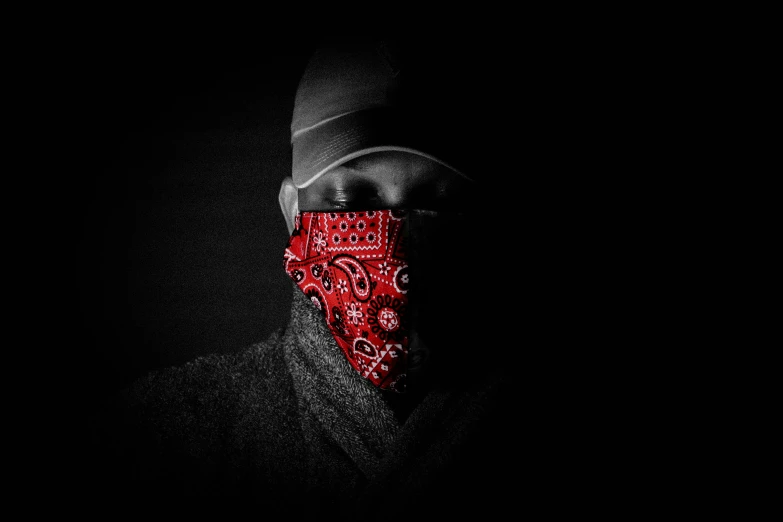 a man in a bandana in the dark