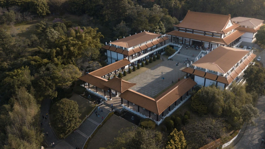 an aerial view of a large, beautiful building with brown roof