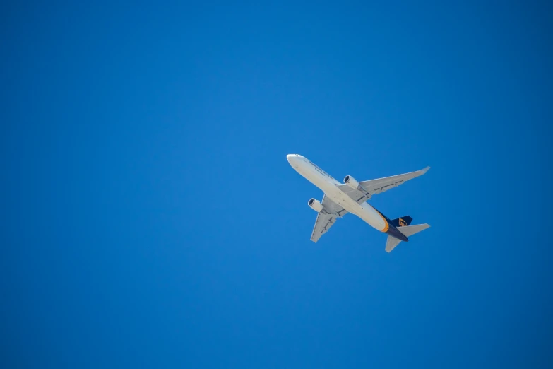 a very large jetliner flying through the sky