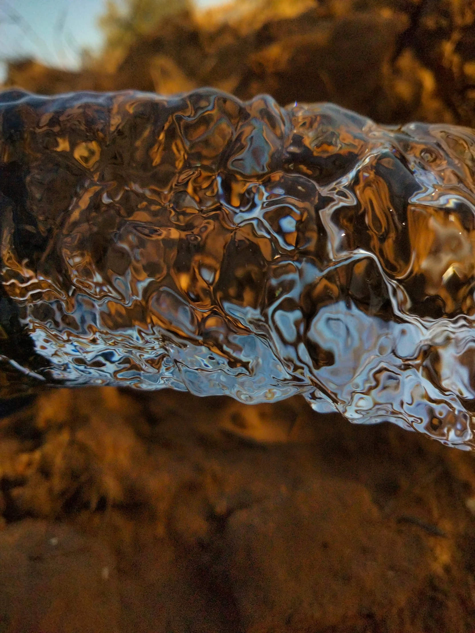 clear water flowing over the top of rocks