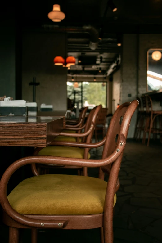 many brown chairs line the edges of a restaurant