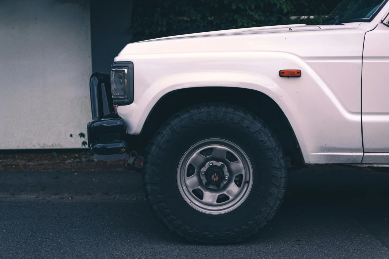 a white pickup truck parked on the street