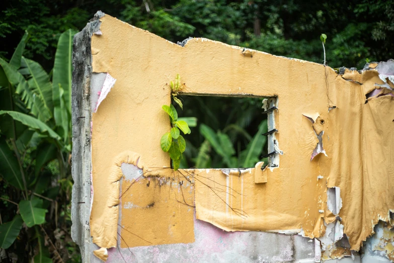 an image of a wall torn down with a window in it