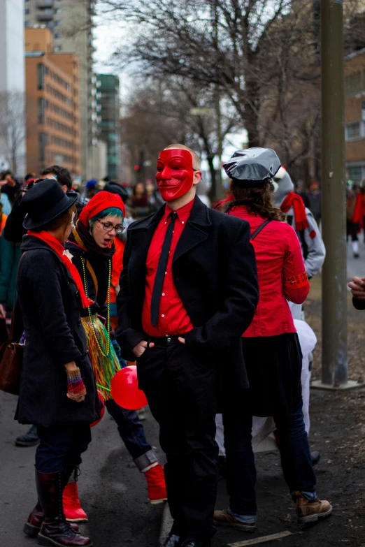 some people wearing red and black in costume