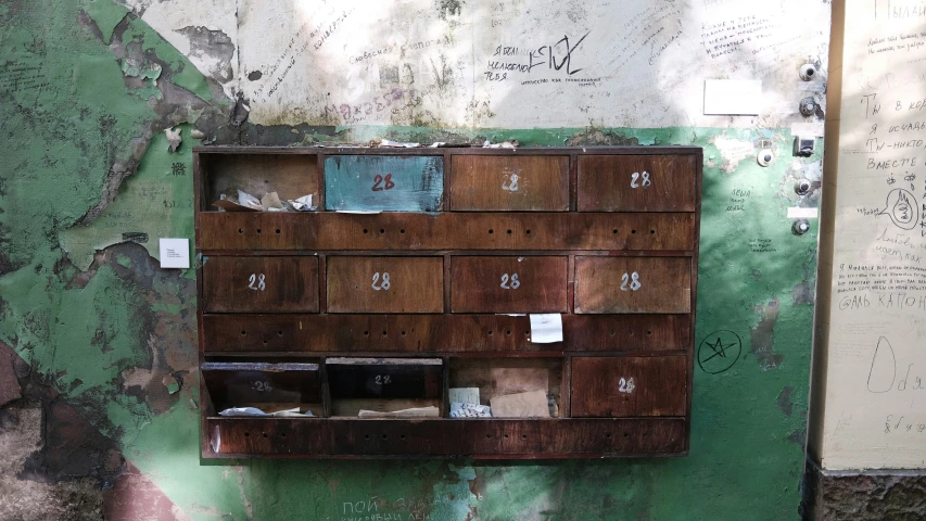 a wooden cabinet with numbers on the side of it