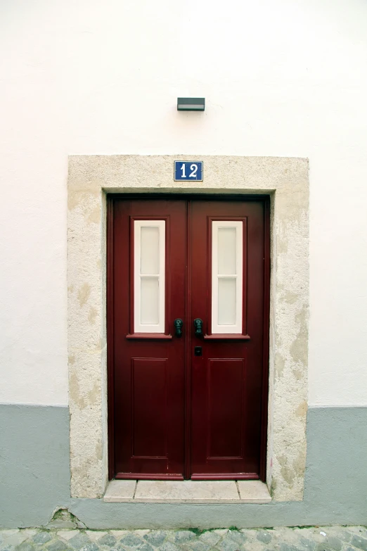 a couple of doors on the side of a building