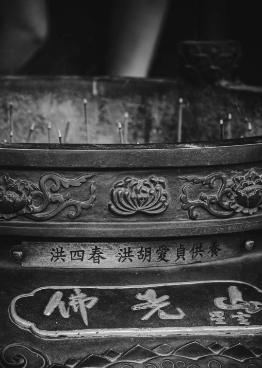 a chinese decoration with writing and candles inside