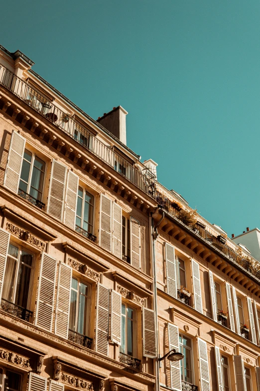 tall building with lots of windows and balconies