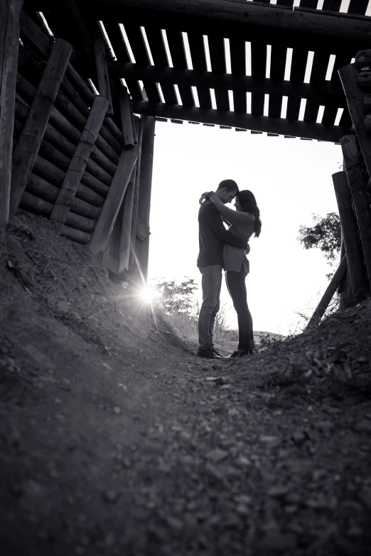 a man and woman emce in a bridge area