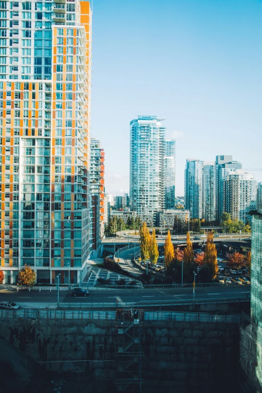 a large white building sitting next to a very tall city