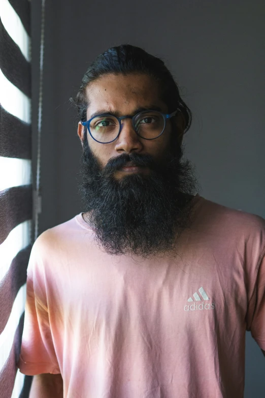 a man with a long beard and glasses