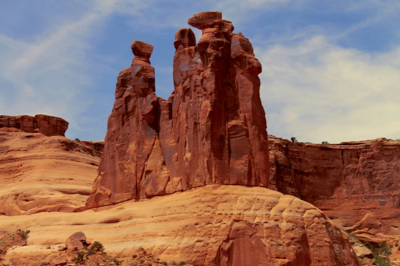 three rock formations in the middle of desert