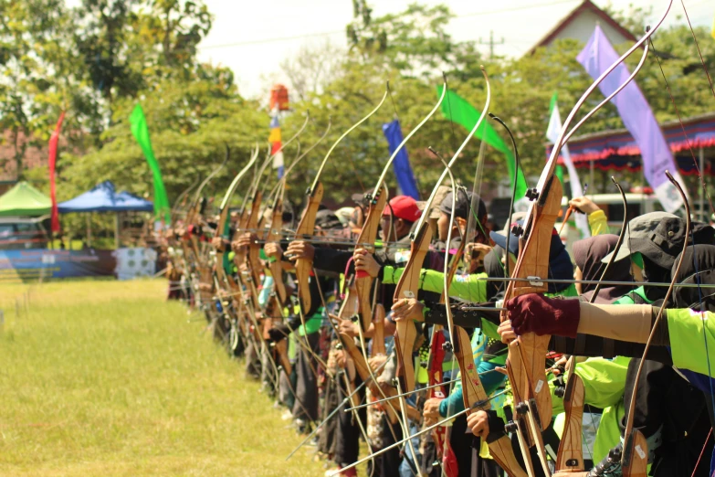 an arrow and bow archery competition is taking place at the park