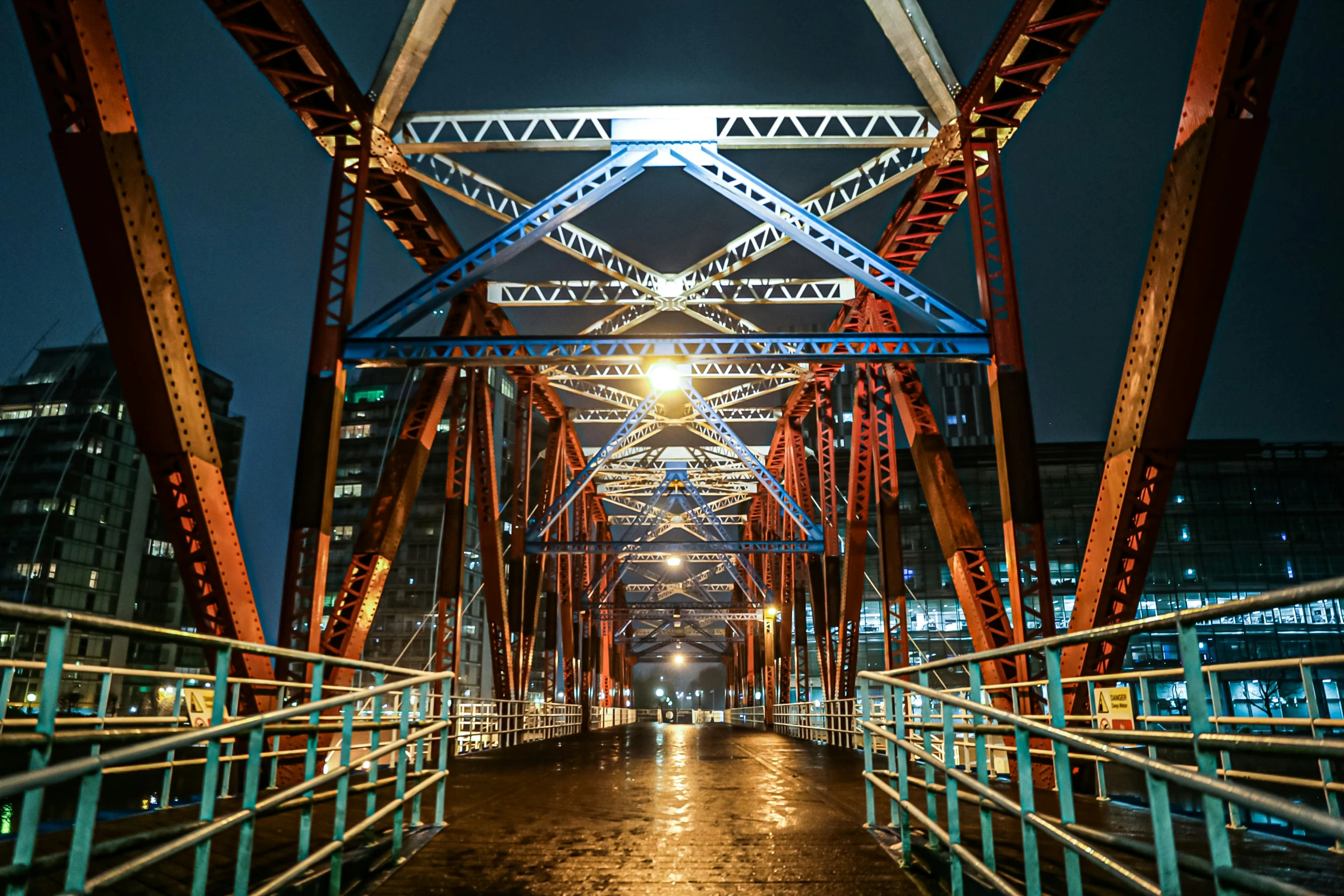 bridge, over which lights shine on a dark night