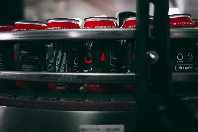 a rack with various red and black cans