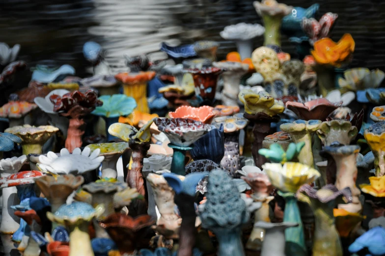 a bunch of colorful ceramic sculptures on display