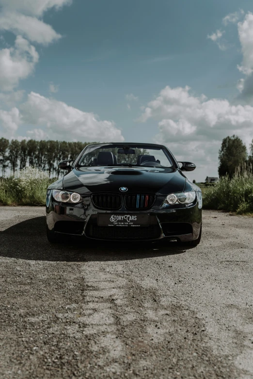 a bmw with an empty parking space on the side