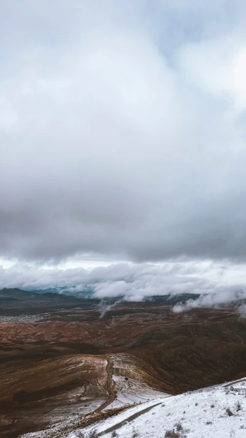 a snowy mountain top with no snow on it