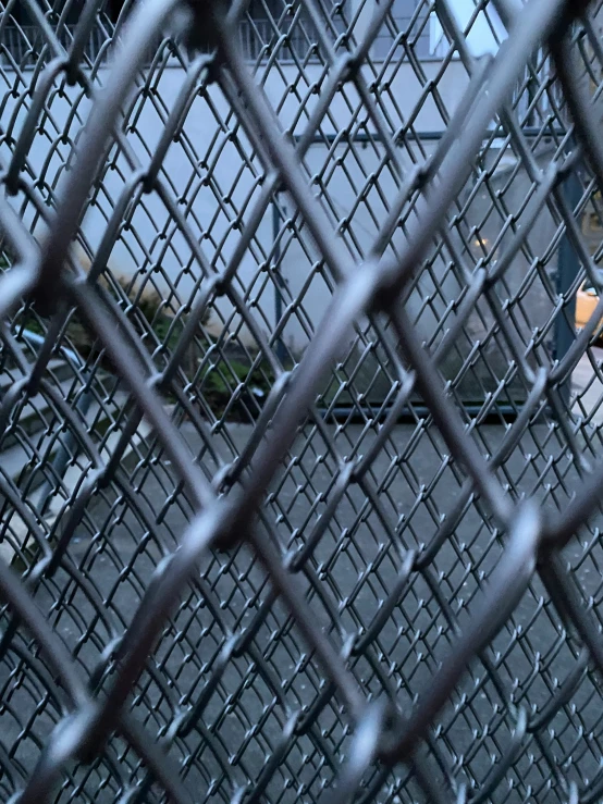 metal grids as seen from behind a fence