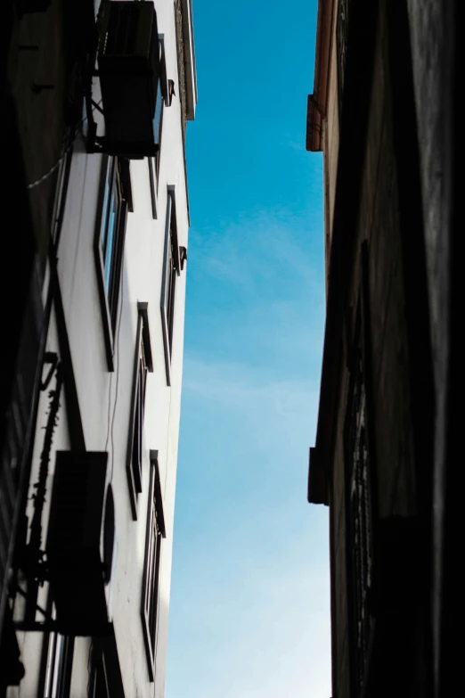 two buildings side by side with a clock at the top