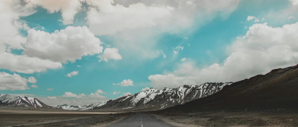 an image of sky with clouds and a road