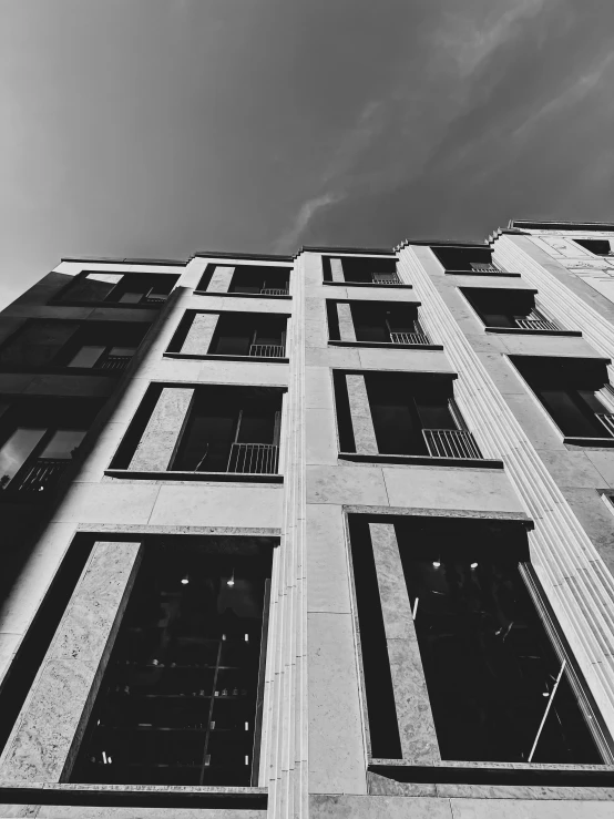 the corner of a building that has multiple windows