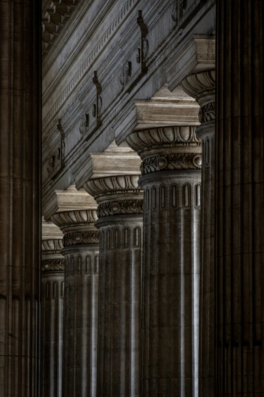 a large building with some columns and lights in it