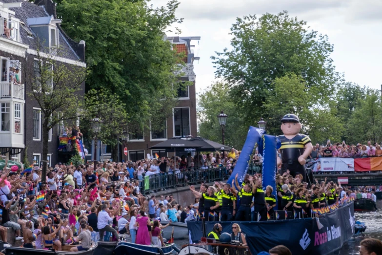 a float with floats in front of a crowd of people