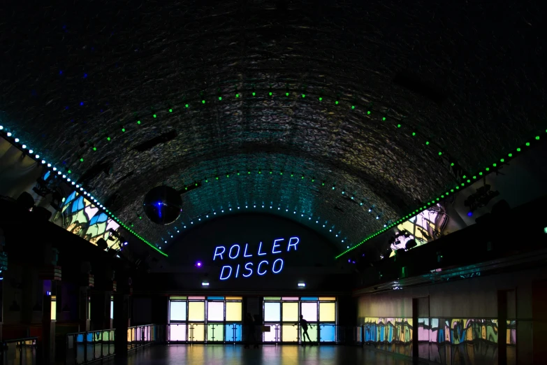 an indoor roller disco with light displays and windows