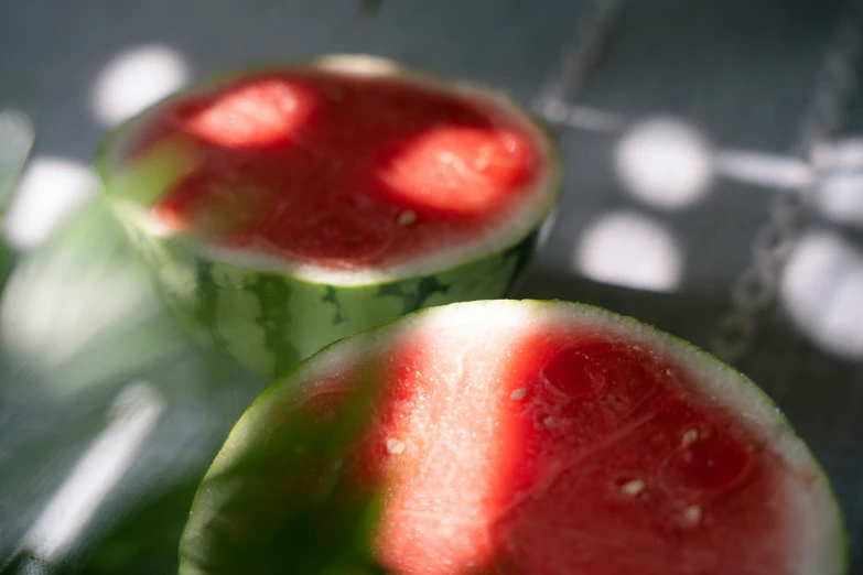 two cut in half watermelon halves placed on top of each other