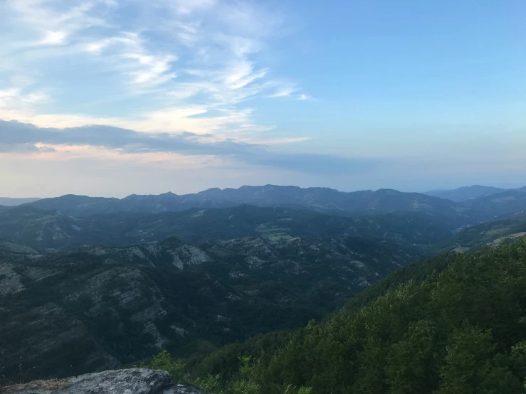 view of mountains from a distance with trees