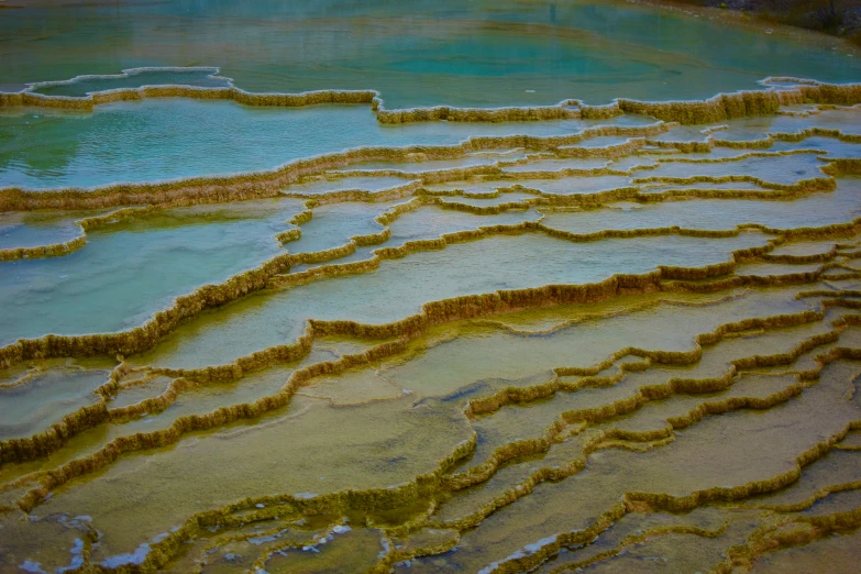 a small patch of water surrounded by a few ripples