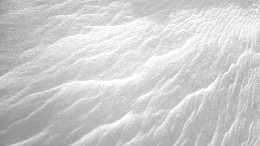 the view from above looking up at a snow skier