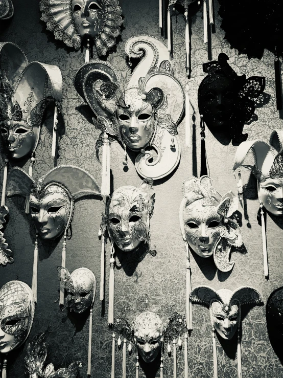 various mask on a stick placed next to each other