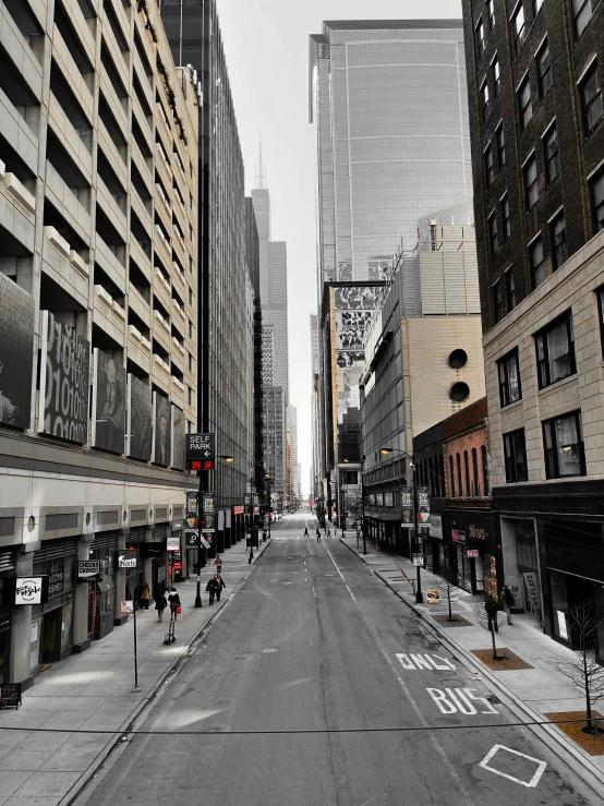 an empty city street is lined with buildings