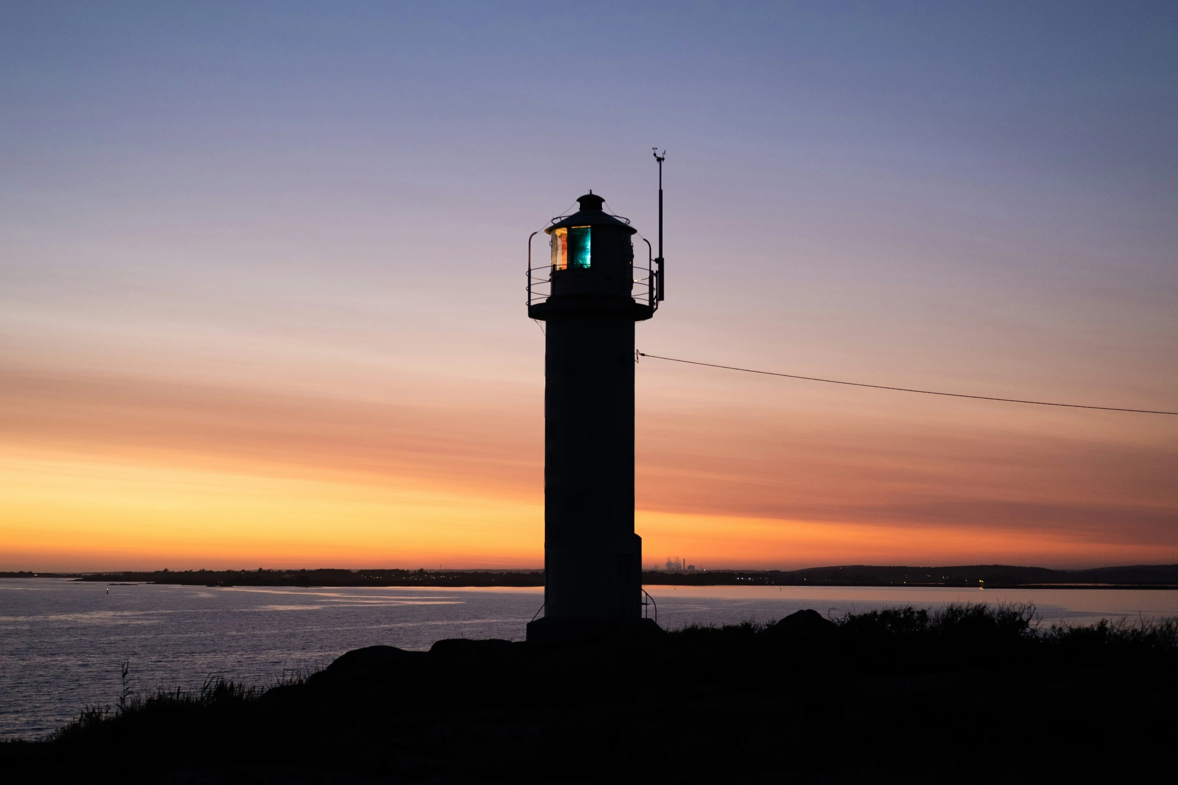 a tower is shown lit up in the sky