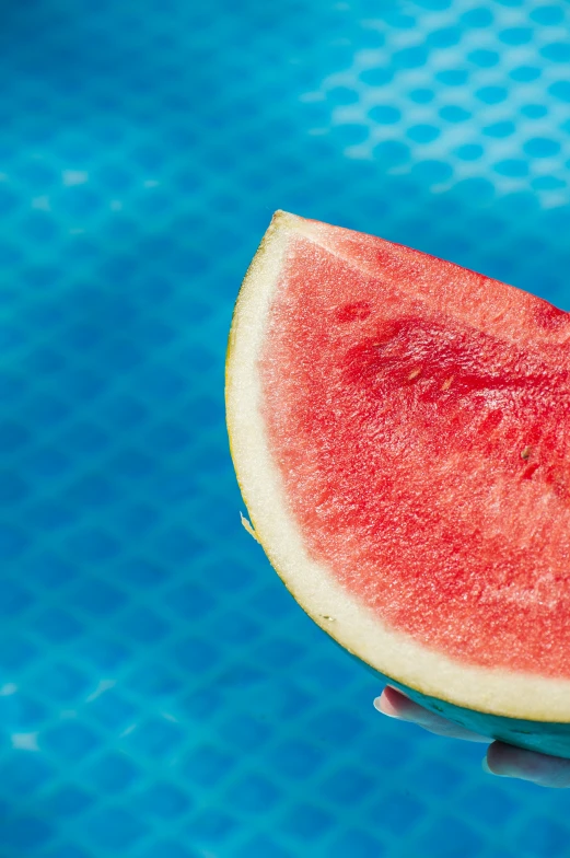 a piece of watermelon sitting on top of a table