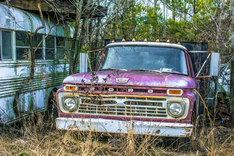 an old run down truck that is parked outside